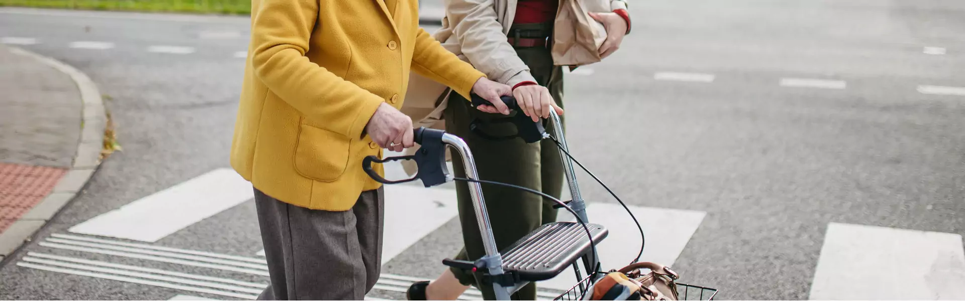 The old lady is using a walking aid.