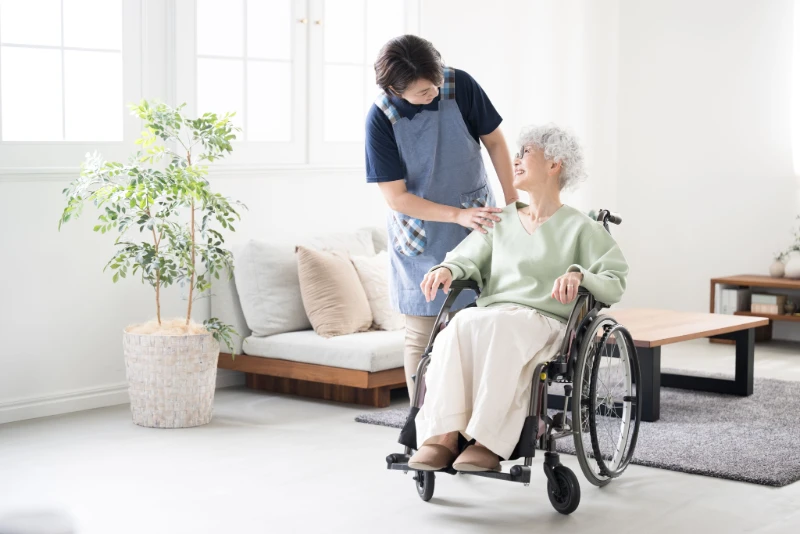 Taking care of an elderly person in a wheelchair at home.