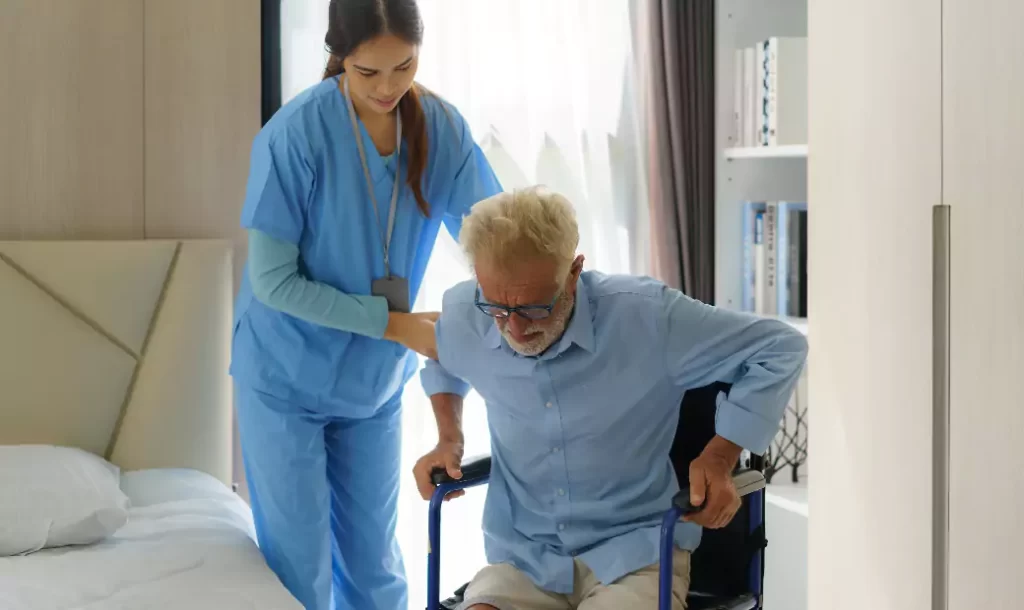 Asian smiling nurse helping senior man get out of bed nursing care support patient