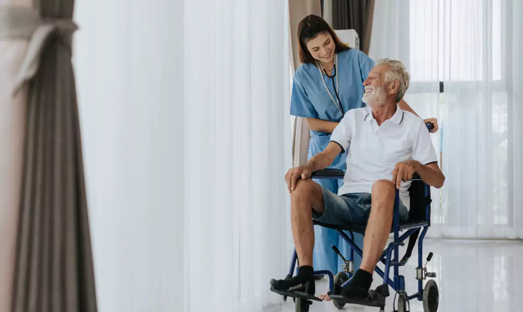 Young asian nurse helping senior man at home.