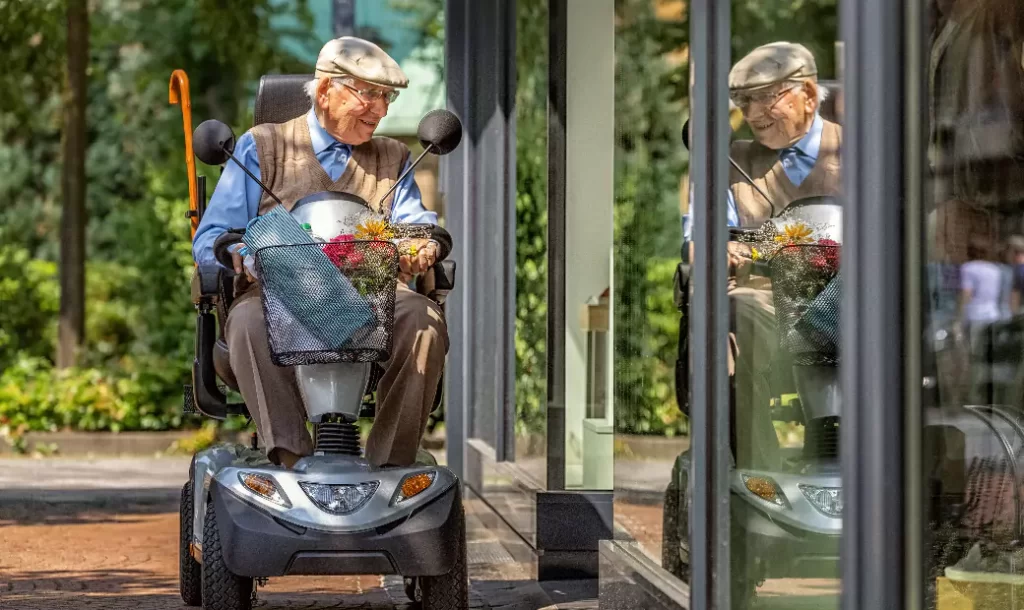 an-elderly-person-is-happily-sitting-on-a-transportation-vehicle