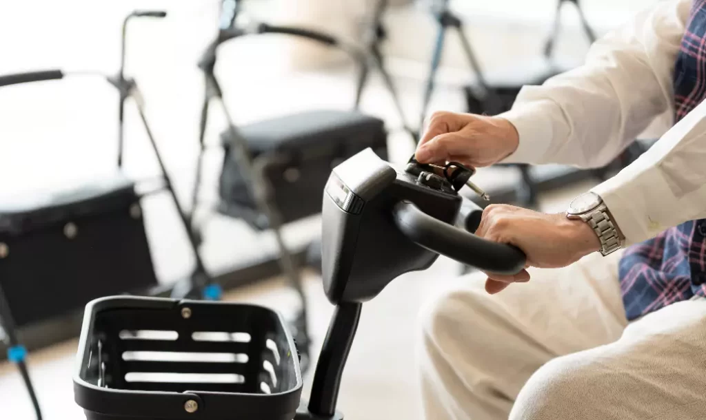older-man-in-an-orthopedic-shop-trying-out-an-electric-scooter