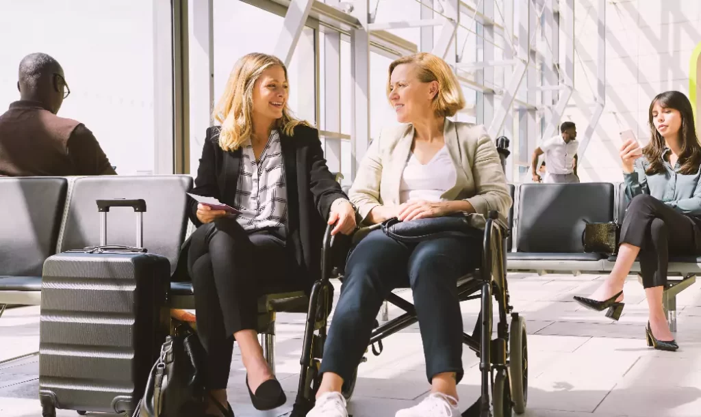 businesswoman-sitting-airport-departure-female-colleague