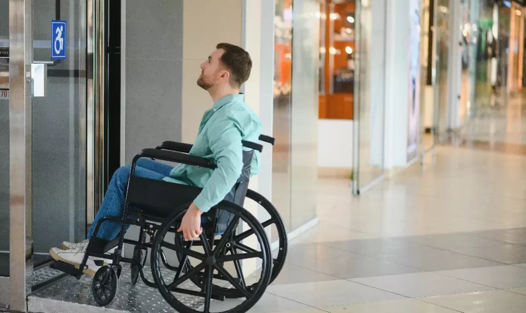 person-disability-exiting-modern-elevator-shopping