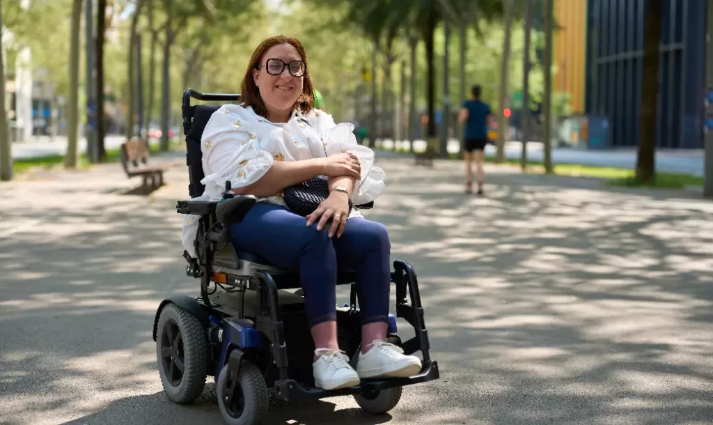 smiling-woman-using-electric-wheelchair-enjoying