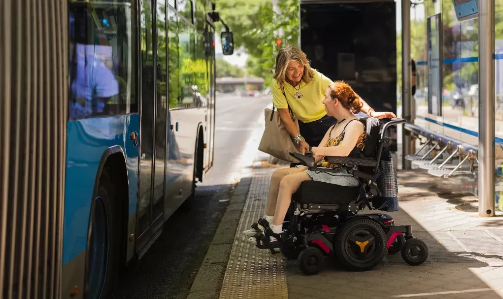 a-young-red-haired-woman-in-a-wheelchair-got-on-a-bus-at-the-city-station