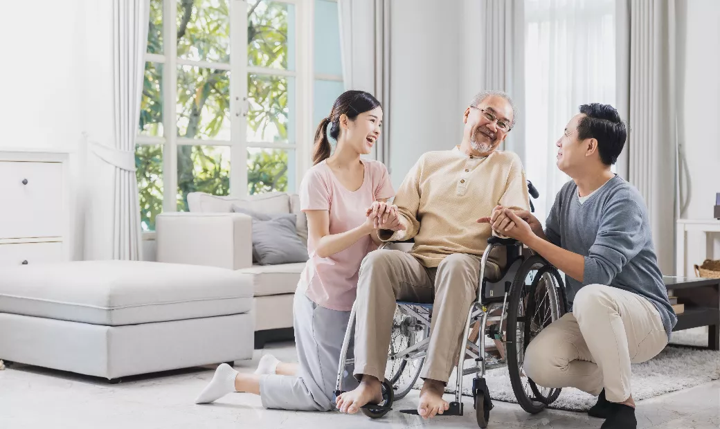 happy-asian-family-of-senior-with-beautiful-daughter-her-husband-and-grandson-take-care-old-man-sitting-on-wheelchair-in-house-positive-dad-have-strength-and-positive-thinking