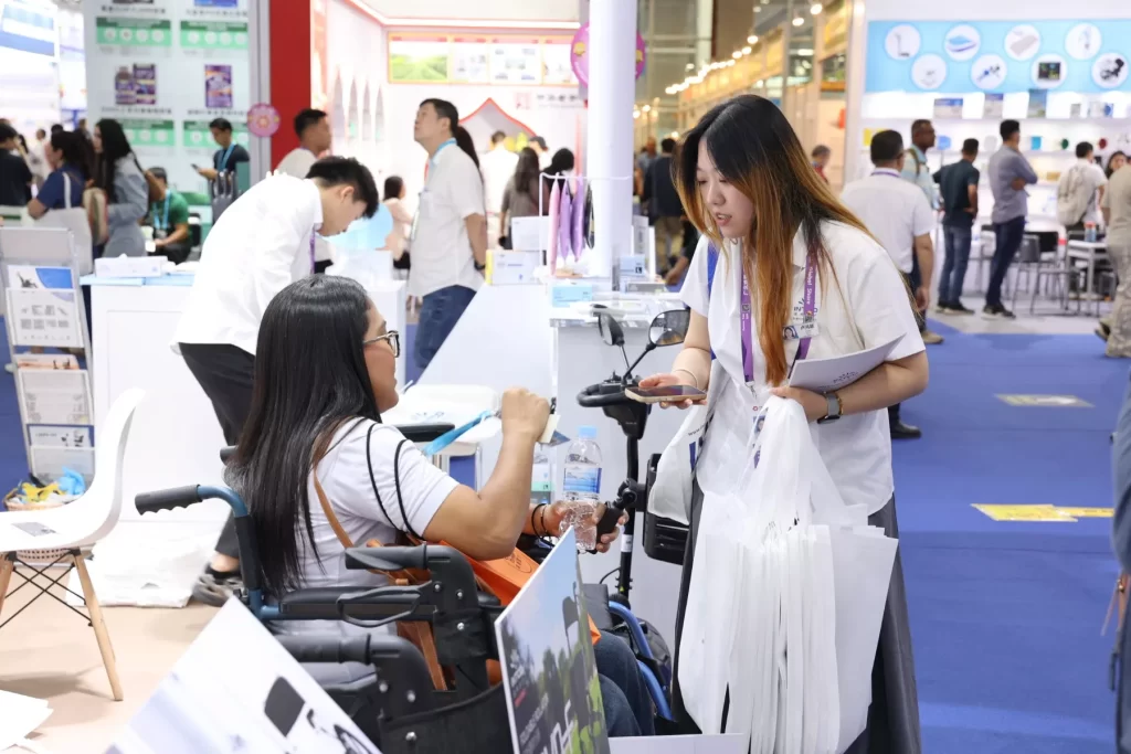 Test-sitting wheelchairs at the exhibition